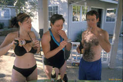 Karalee, Jess and Scott, looking at Scott and Karalee's bedtime pictures