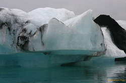 Changing tide levels melting a grounded berg