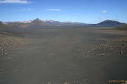 Dots of people walking across the sandur