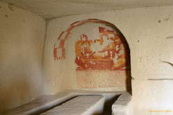 Frescos at the end of a dining table