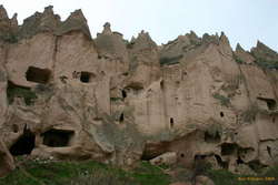 The town is cut into the side of the valley, not into isolated cones