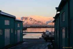 Esja glowing over the small boat harboir