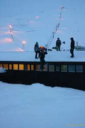 Punk kid skiing off the roof