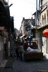Workmen in a side alley