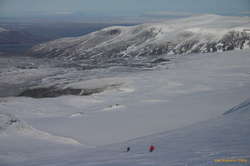 Siggi and Aadne skiing down W edge of Langjökull, Eríksjökull in background