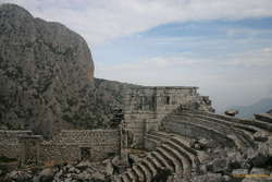 Mountains in the background gorge behind, a theatre with a view