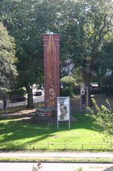 A war memorial with a war protest around it