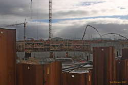 Lots and lots of men working on the concert hall