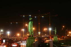 The men watching their city get rebuilt