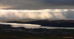 Sunlit clouds over Egilsstaðir