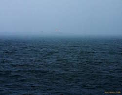 Wet snow and fog, looking back at downtown, from Laugarnes