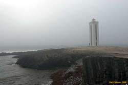 Seashore and lighthouse at Kálfhamarsvík