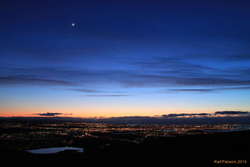Moon over Reykjavik, from Ulfarsfell