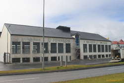 Work on the Ó. Johnson and Kaaber building shows up the old signage