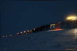 Trudging uphill, into the snow and the dark