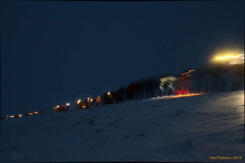 Trudging uphill, into the snow and the dark