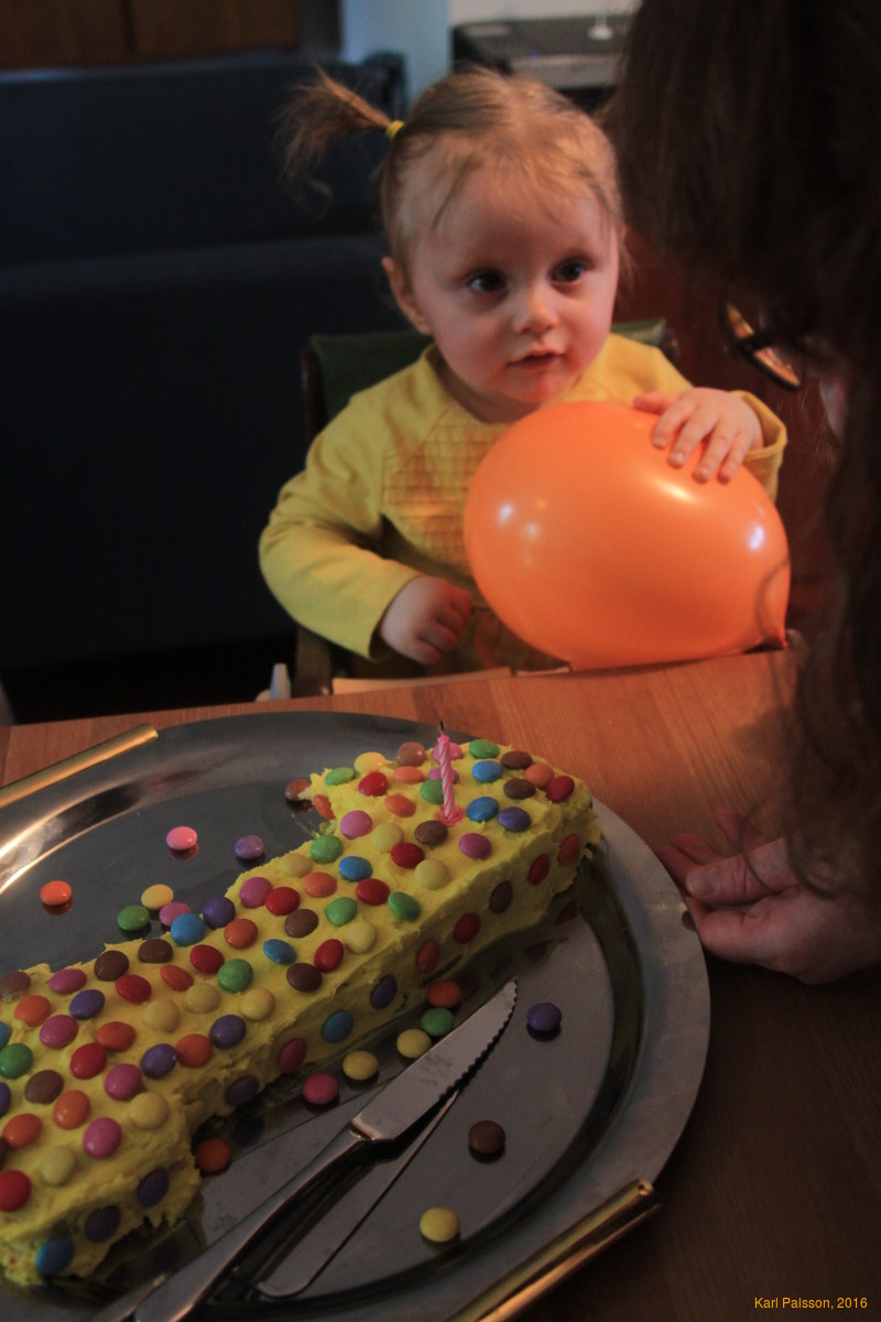 Help from mum blowing out her candle