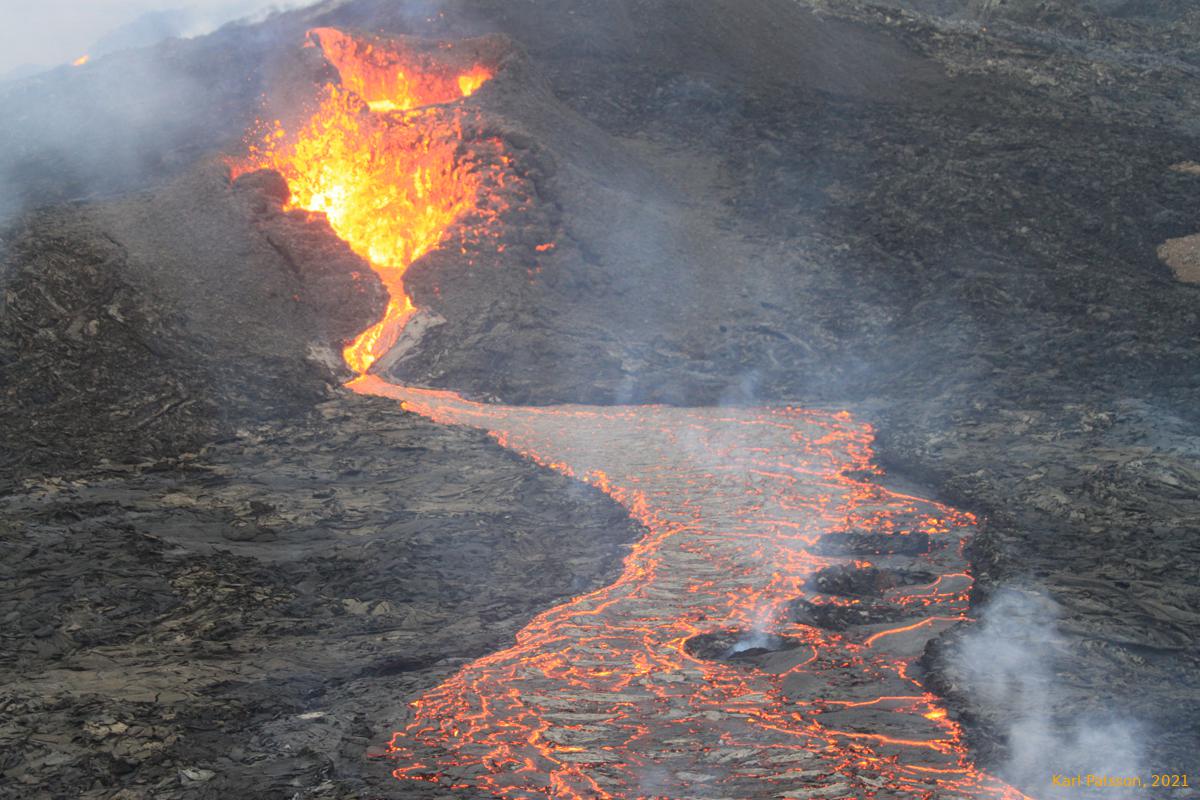 Lava flow in lava flow, surounded by lava flow, with cinder on top